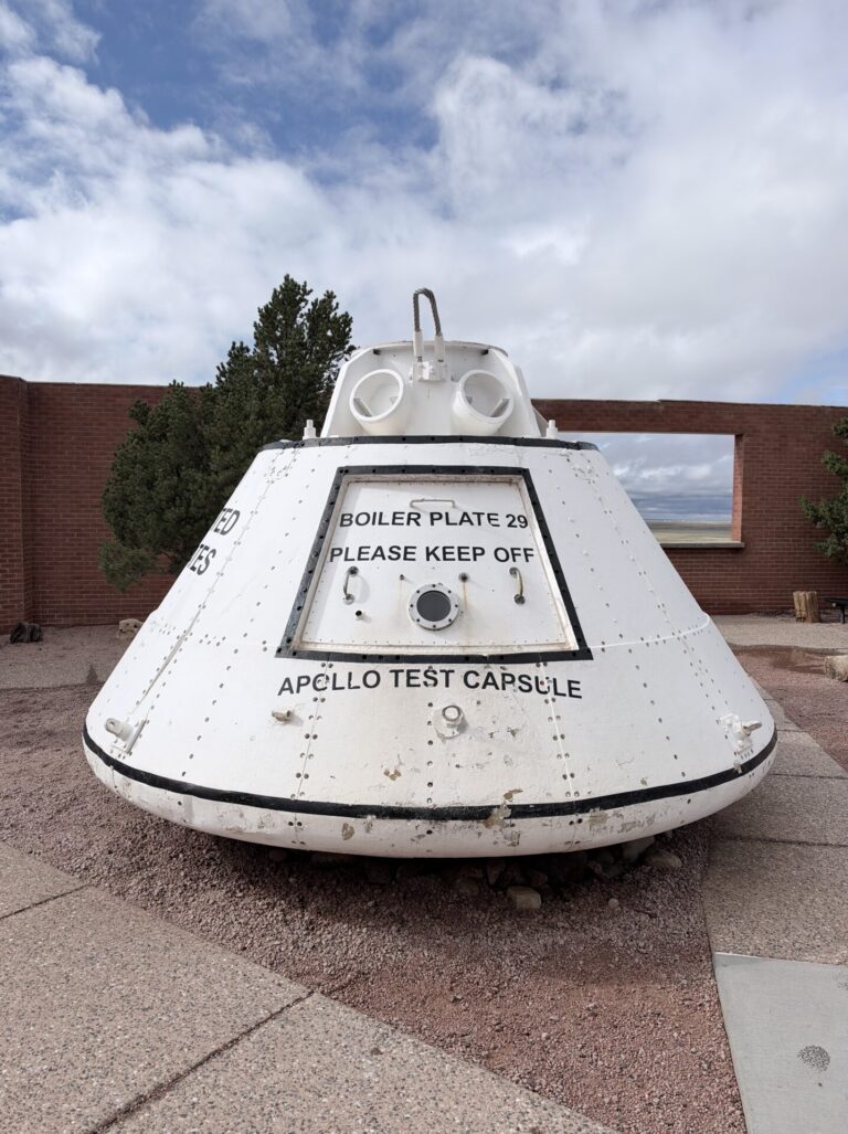 Apollo-style command module capsule displayed outside the Meteor Crater visitor center in Arizona.